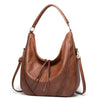 Minervas klassische Vielseitigkeit | Vintage Leder Tasche